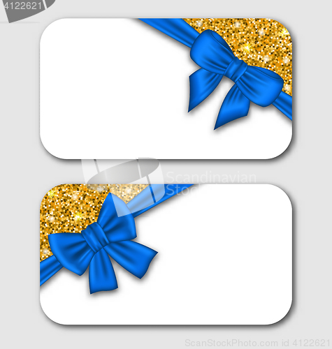 Image of Gift Cards with Blue Bow Ribbon and Golden Surface.