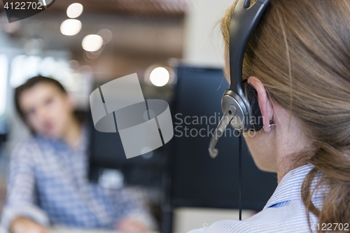 Image of female support phone operator