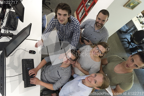 Image of startup business people group working as team to find solution