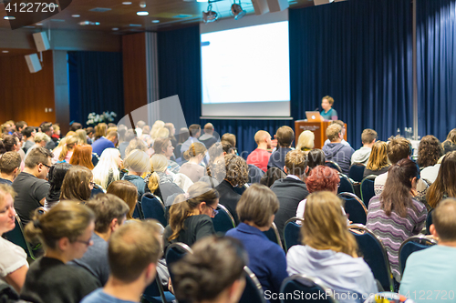 Image of Audience in lecture hall participating at business event.