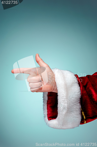 Image of Photo of Santa Claus hand in pointing gesture