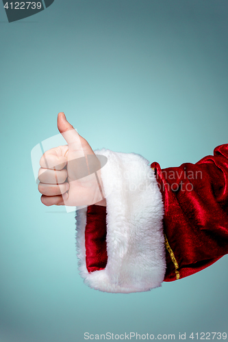 Image of Santa Claus hand showing thumbs up