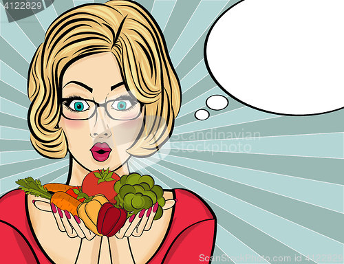 Image of Surprised pop art  woman that holds vegetables  in her hands . C