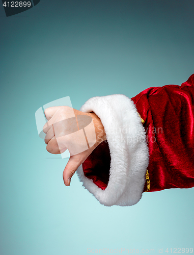 Image of Photo of Santa Claus hand in pointing gesture