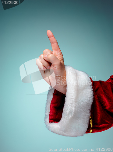 Image of Photo of Santa Claus hand in pointing gesture