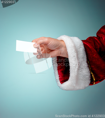 Image of Photo of Santa Claus hand with a business card