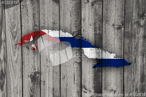 Image of Map and flag of Cuba on weathered wood