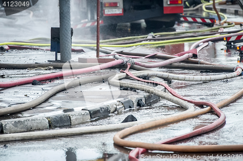 Image of fire-prevention siphon or gate a tee and hoses for water are connected after firefight