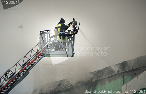 Image of Firefighters in action fighting fire