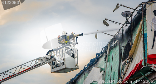 Image of Firefighters in action fighting fire