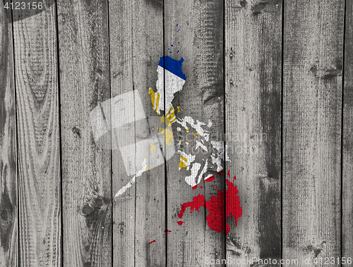 Image of Map and flag of the Philippines on weathered wood