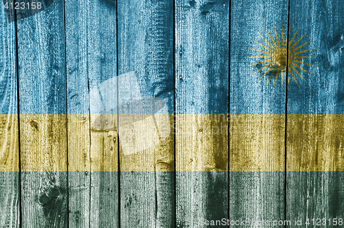 Image of Flag of Rwanda on weathered wood