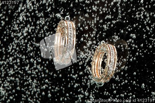 Image of Golden Rings In The Water
