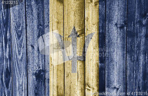 Image of Flag of Barbados on weathered wood