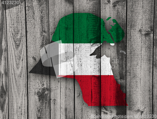 Image of Map and flag of Kuwait on weathered wood