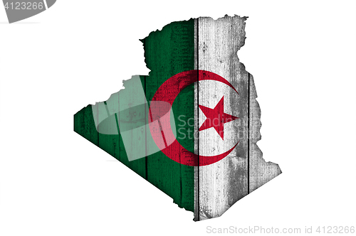 Image of Map and flag of Algeria on weathered wood