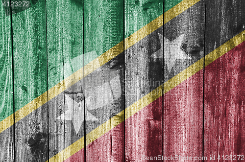 Image of Flag of Saint Kitts and Nevis on weathered wood