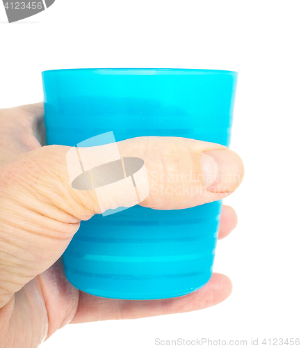 Image of Empty blue plastic glass, held in a male persons hand