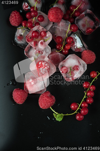 Image of Frozen berries on wooden table