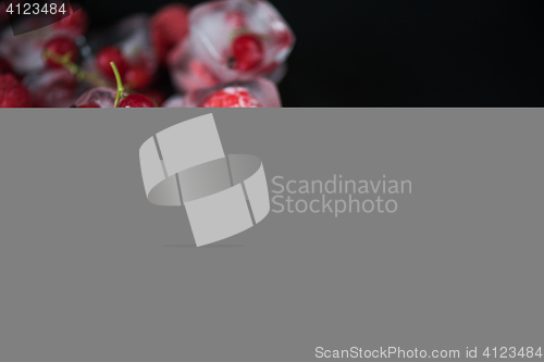 Image of Frozen berries on wooden table