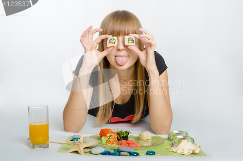 Image of Young girl put roll your eyes and stuck out her tongue