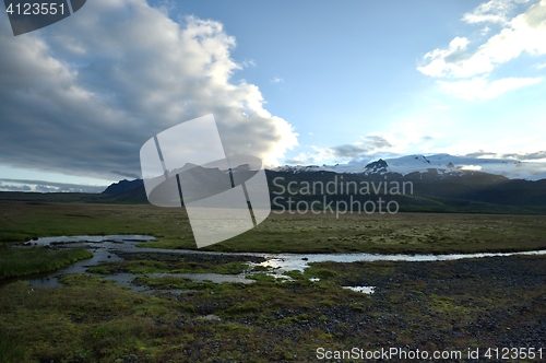 Image of Icelandic landscape with blue sky and clouds