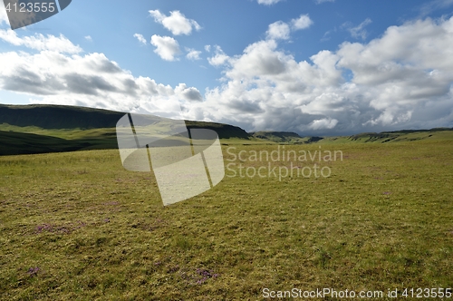 Image of Icelandic landscape with blue sky and clouds