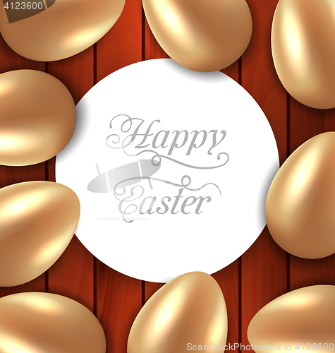 Image of Congratulation card with Easter golden glossy eggs on wooden bac