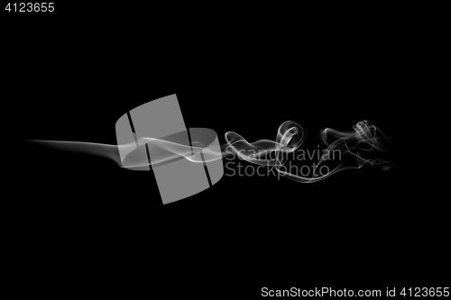 Image of Gray smoke wave isolated on white. Gray smoke trail isolated on white. Horizontal wave.