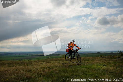 Image of Young man is riding bicycle outside. Healthy Lifestyle.