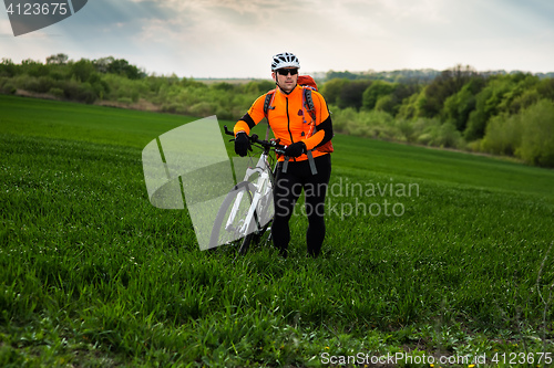 Image of Young man is riding bicycle outside. Healthy Lifestyle.