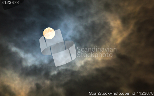 Image of Mysterious midnight cloudy sky with full moon and moonlit clouds