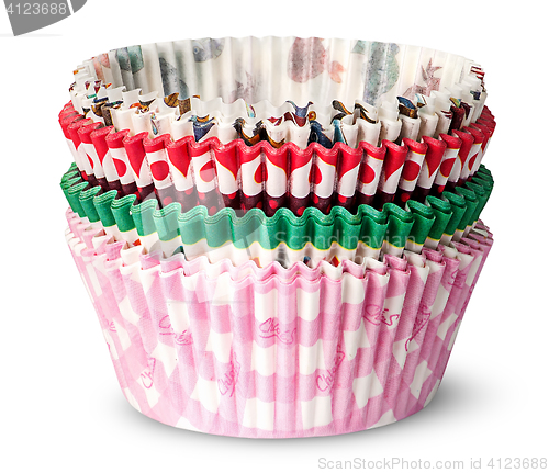 Image of Stack of multicolored paper cups for baking muffins
