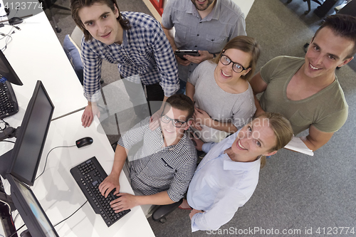 Image of startup business people group working as team to find solution