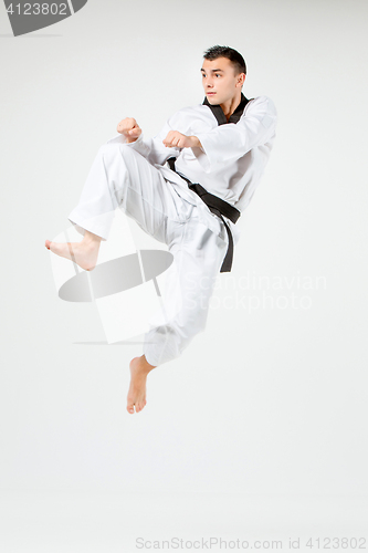 Image of The karate man with black belt