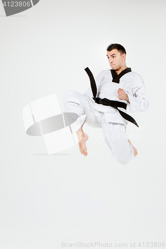 Image of The karate man with black belt