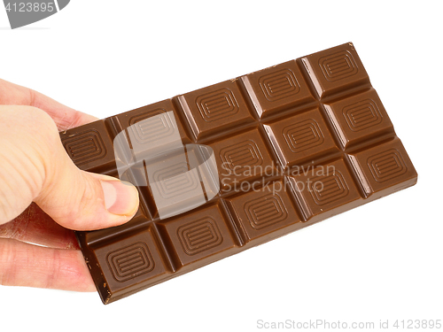Image of Person holding a whole bar of light chocolate isolated towards w