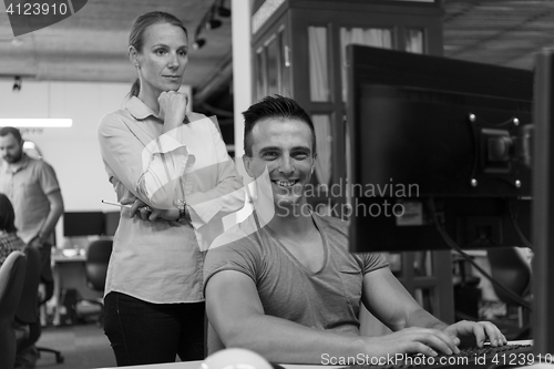 Image of business couple at office