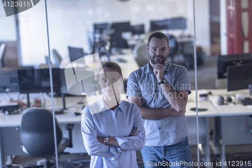 Image of business couple at office