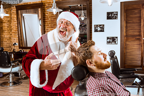 Image of Santa claus as master at barber shop