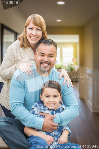 Image of Mixed Race Family Portrait Inside Their New House.
