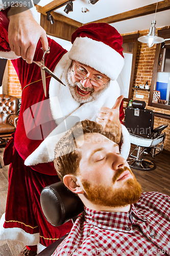 Image of Santa claus as master at barber shop