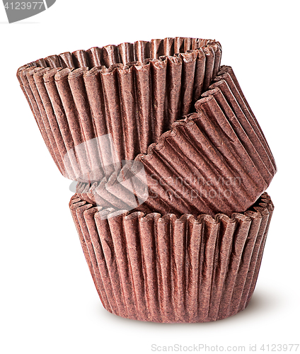 Image of Heap of brown paper cups for baking muffins