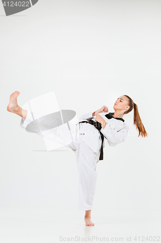 Image of The karate girl with black belt