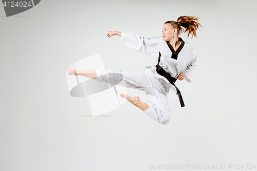 Image of The karate girl with black belt