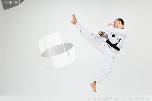 Image of The karate man with black belt