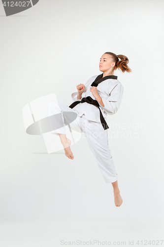 Image of The karate girl with black belt