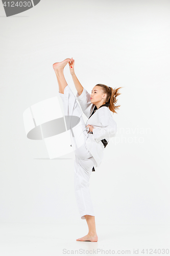 Image of The karate girl with black belt