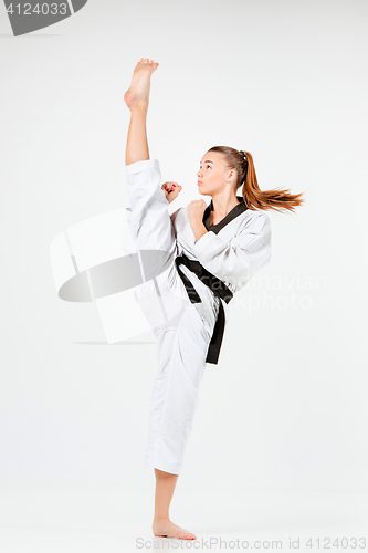 Image of The karate girl with black belt