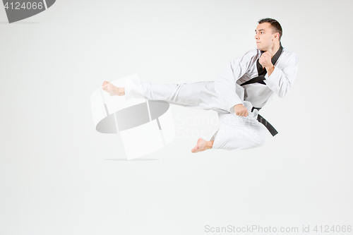 Image of The karate man with black belt